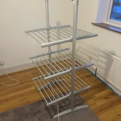 Heated clothes drying rack