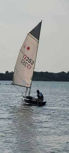 Laser 13 sailboat with road and launching trailer
