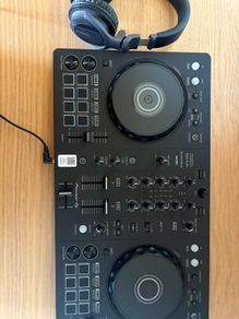 Pioneer DJ DDJ FLX4 with headphones