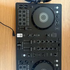 Pioneer DJ DDJ FLX4 with headphones
