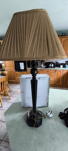 Vintage ebonized table lamp featuring an octagonal base, likely dating from the early 20th century.