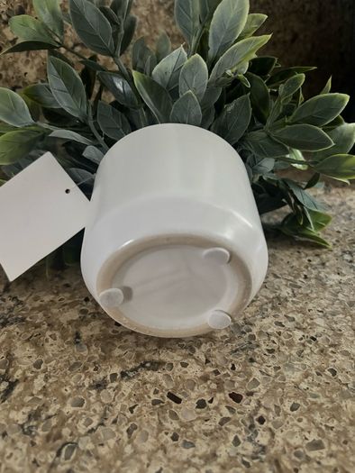 artificial plant in white pot home decor