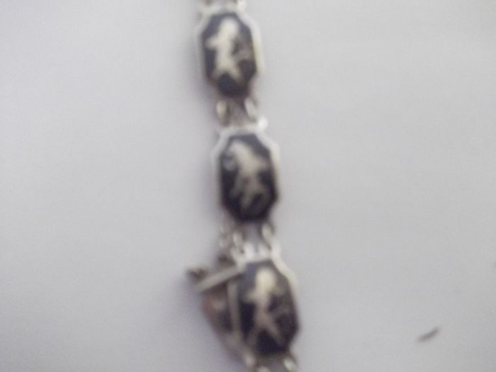 a vintage silver and enamel bracelet