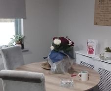 table and four chairs and four cream chair covers