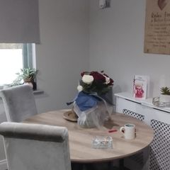 table and four chairs and four cream chair covers