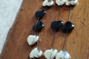 Stylish Long Necklace of Black and Gold Hearts.