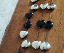 Stylish Long Necklace of Black and Gold Hearts.