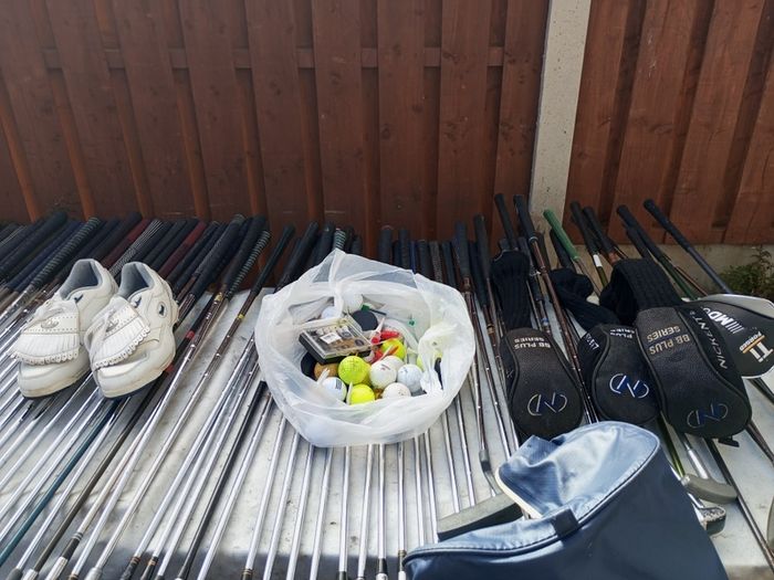 A selection of golf clubs and bags. All right handed clubs.