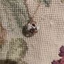 Rose gold chain with a sphere shaped pendant Image 3