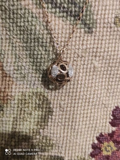 Rose gold chain with a sphere shaped pendant