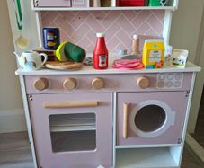 Wooden kitchen with kitchen toys