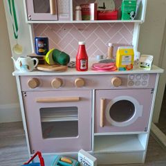 Wooden kitchen with kitchen toys