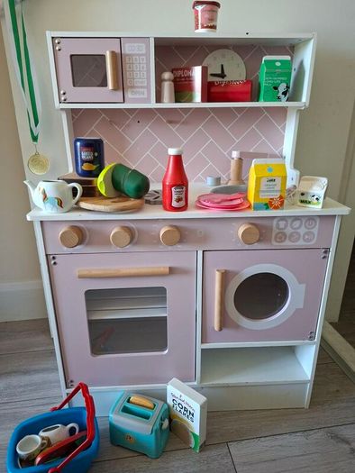 Wooden kitchen with kitchen toys