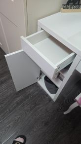 desk or dresser with drawers and door