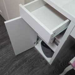 desk or dresser with drawers and door