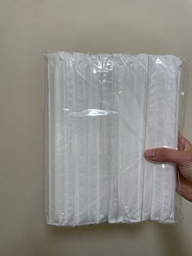 A box of Paper cups and a box of straws