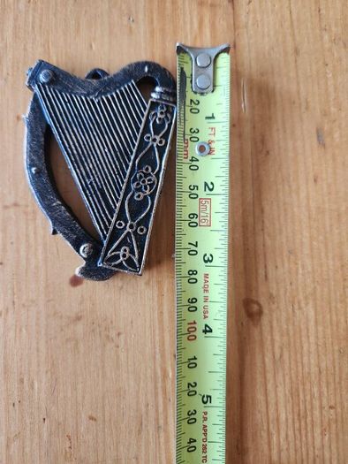 8 Items. 4 X Cast Metal Bottle Openers, A Cast Wallmounted Celtic Cross, 3 Harps For Decorative Purposes.