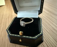 18ct yellow gold solitaire with diamond surround