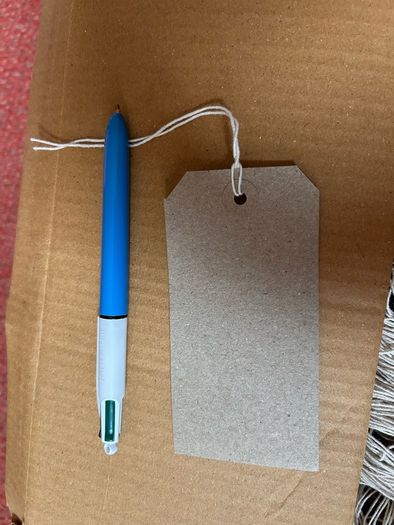 Box of strung tags/labels
