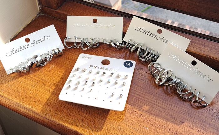 Silver colour earrings , approx 36 pairs