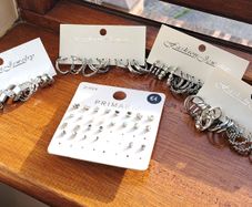Silver colour earrings , approx 36 pairs