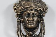Bronzed cast iron door knocker
