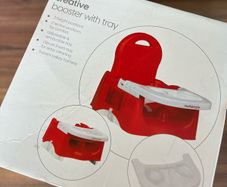 High chair / booster seat with tray.