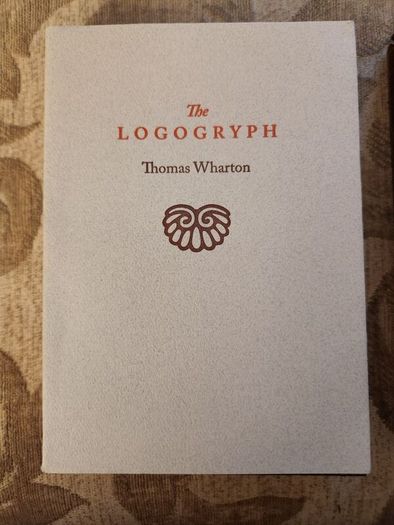 The Logogryph. By Thomas Wharton. First Edition Complete With Presentation Sleeve Paperback In Very Good Condition. 37