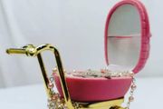small pram with baby rosary beads