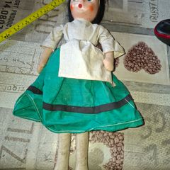 Vintage 1940s Papier Mache Doll, featuring a painted face on a soft fabric body,