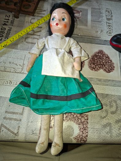 Vintage 1940s Papier Mache Doll, featuring a painted face on a soft fabric body,