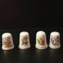 Collection of Flower Themed Gold Coloured Edged Thimbles Image 6