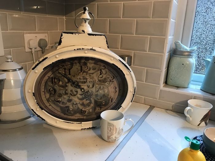 Clock with moving gears