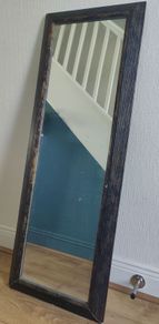 Wall Mirror with Brown frame.