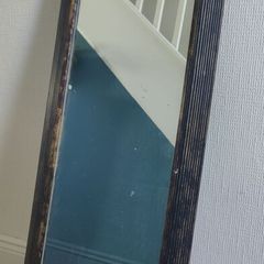 Wall Mirror with Brown frame.
