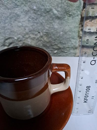Dark and light brown cup and saucer