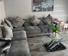 corner sofa and pouffe