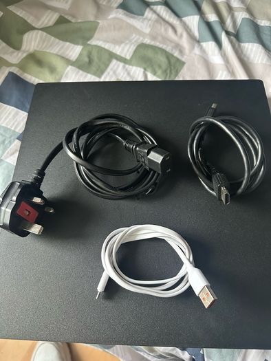 PlayStation 4 Pro 1TB SSD with games, cables and controller