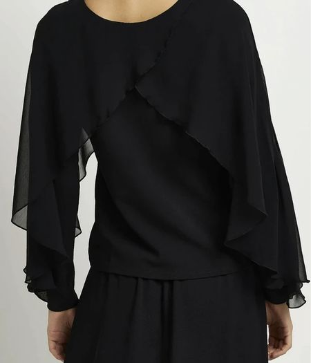 Top with cape-style overlay