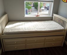 Single white pull out bed