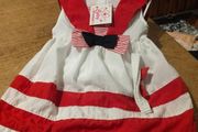 This is a Cutey Avenue brand 18-24 month red and white striped sailor-style dress. New with tags