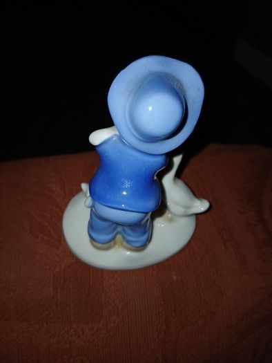 Figurine of a young Boy, 3 ducks