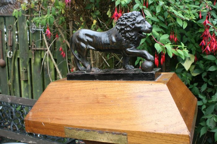 Antique Cast Iron Lion Figurine on Wooden Base