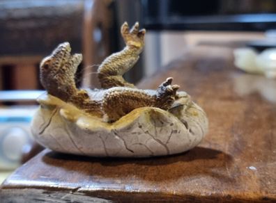 Hatching dinosaur toy figurine