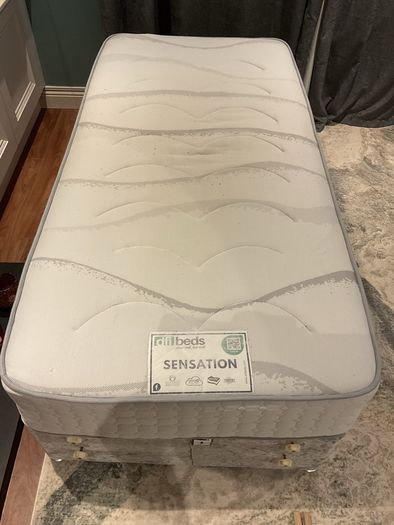 Single bed with headboard