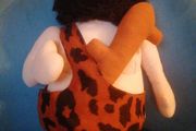 vintage caveman plush toy