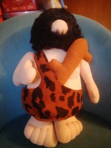 vintage caveman plush toy