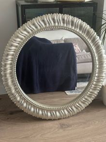 Large silver circular mirror