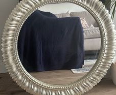 Large silver circular mirror