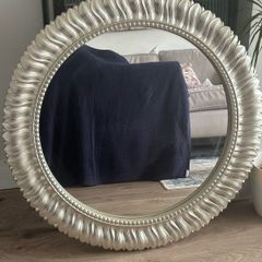 Large silver circular mirror